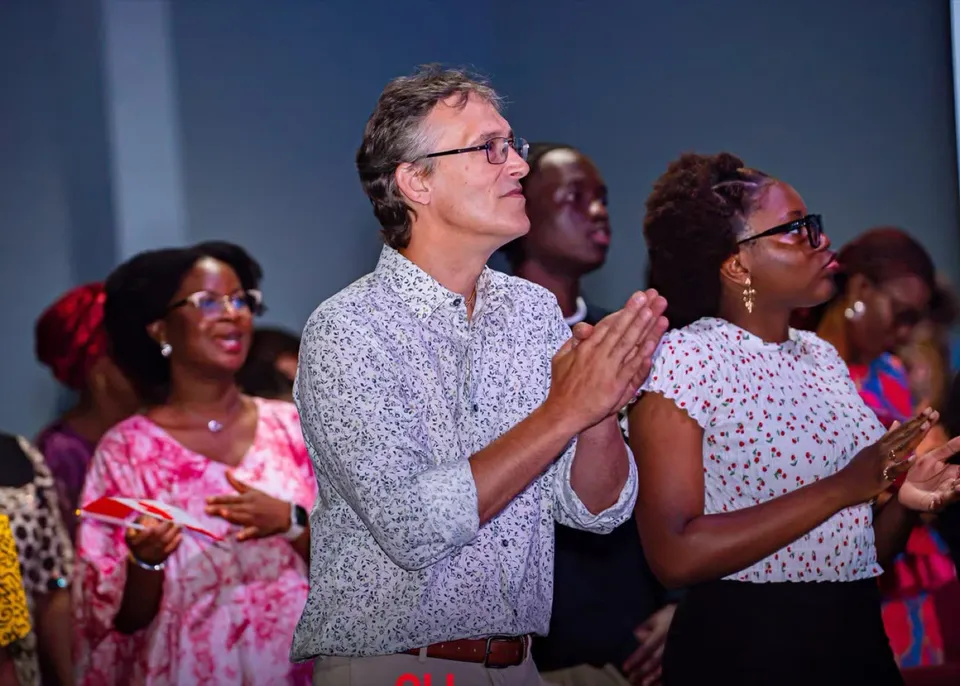 Diverse congregation members standing and clapping during a service at Kingdom Stars Assembly in Guelph